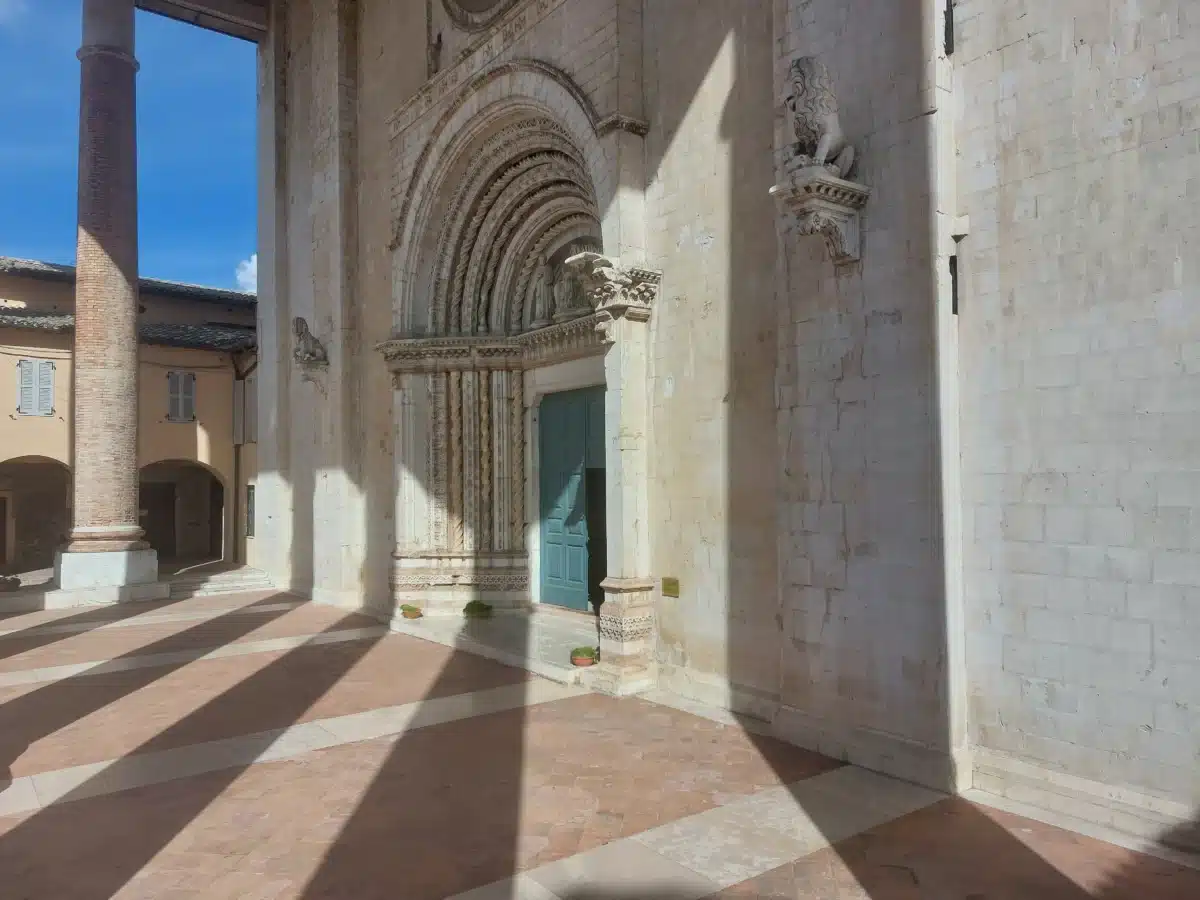 Gothic carved portal and stone facade of the Basilica of San Venanzio in Camerino