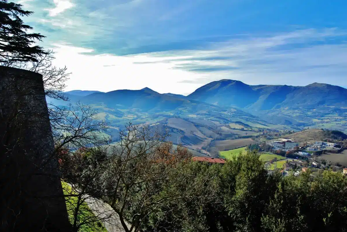 View from the Rocca in Camerino over wooded hills toward the Apennine mountains