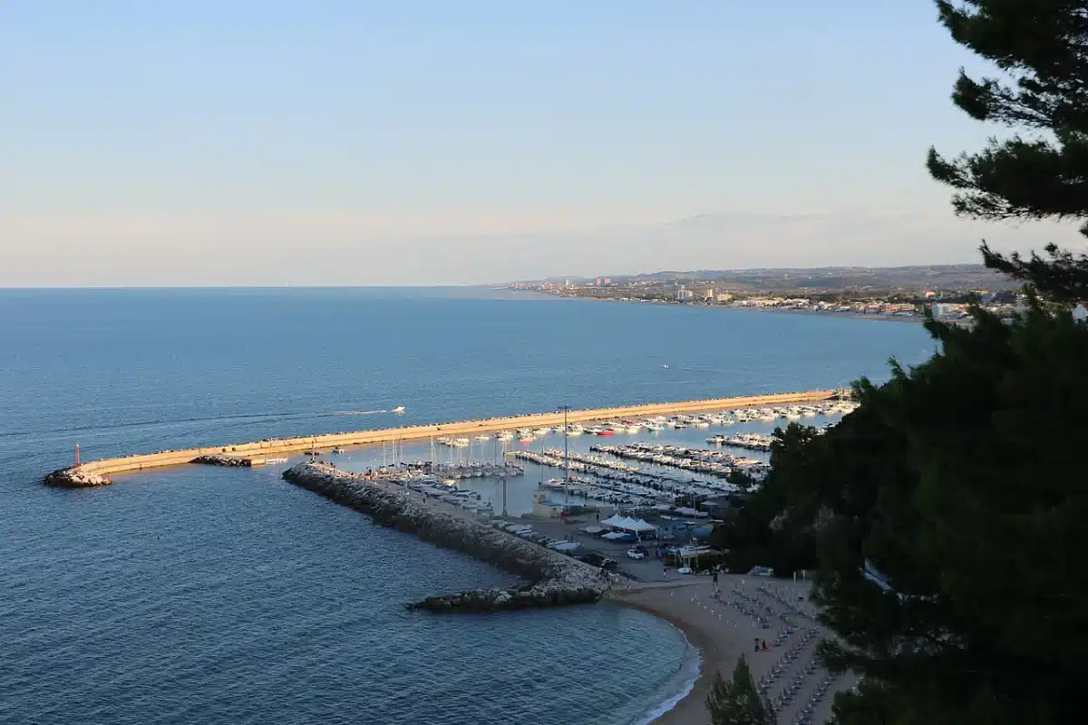 The tourist harbor of Numana seen from the belvedere with the coast stretching south